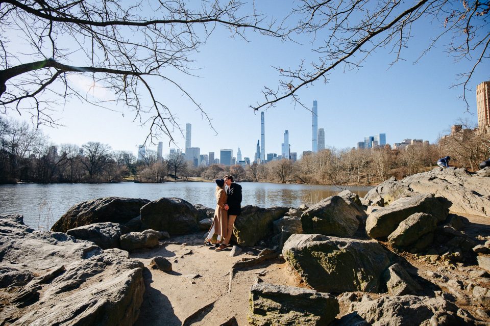 young couple got engaged by the Central Park lake